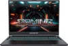 A black Gigabyte gaming laptop is shown from a front-facing angle, with its screen displaying a futuristic, neon-lit tunnel with the word "GAMING" in large, metallic letters. Produktbild-Vorschau