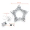 A silver wire star light with battery pack and measurement indicators. Anteprima dell’immagine prodotto