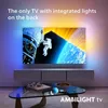 A TV displaying a space scene with integrated lights on the back, set in a living room environment. Anteprima dell’immagine prodotto