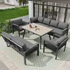 An outdoor patio set with a table and seating arranged on a patterned rug. Produktbild-Vorschau