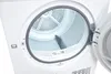 Close-up interior view of a white tumble dryer drum with the door ajar. Produktbild-Vorschau