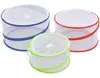 Three food covers of different colors are arranged in a group against a white background. Produktbild-Vorschau