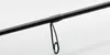 A close-up view of a black fishing rod with a guide. Náhled obrázku produktu