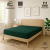 A dark green fitted sheet is shown on a wooden bed frame in a bedroom setting. Produktbild-Vorschau