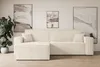 A modern living room with a beige sectional sofa.