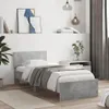 A bedroom scene with a single bed, nightstand, and artwork on the wall. Podgląd zdjęcia produktu