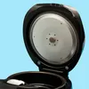 Close-up view of an open rice cooker lid, showing the interior. Anteprima dell’immagine prodotto