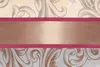 A close-up of a fabric with a damask pattern and a horizontal band. Produktbild-Vorschau