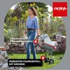 A woman is shown using a garden shredder in a garden setting. Anteprima dell’immagine prodotto