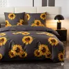 A bed with sunflower-patterned bedding. Anteprima dell’immagine prodotto