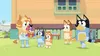 A family of dogs are gathered in a backyard, with one dog holding a bouquet of flowers. Náhled obrázku produktu