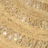 A close-up view of a braided jute rug with a textured pattern. Podgląd zdjęcia produktu