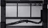 A close-up view of the back of a computer case, showing ventilation and cable management. Voir les images du produit