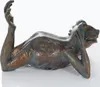 A bronze sculpture of a frog-like creature lying on its side, with one arm raised. Produktbild-Vorschau
