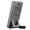 The back of a gray digital weather station with a kickstand and an external sensor attached. Produktbild-Vorschau