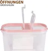A close-up of a clear plastic food storage container with a pink lid and two openings. Anteprima dell’immagine prodotto