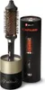 A round hairbrush and its cylindrical packaging are displayed against a white background. The packaging is black with gold accents and text. The brush is black with a copper-colored barrel and bristles. Voir les images du produit