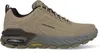 A side view of a tan Skechers men's hiking shoe with a gray sole and yellow Goodyear logo. Produktbild-Vorschau