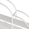 Close-up view of a white shelf unit with curved supports. Náhled obrázku produktu