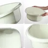 A collage of four close-up images of a cream-colored plastic basin, showing different angles and details. Produktbild-Vorschau