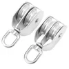 Two stainless steel double pulleys are shown against a white background. Voir les images du produit