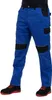 A person wearing blue work pants and black and red shoes, shown from the waist down against a white background. Produktbild-Vorschau