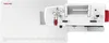 A top-down view of a white sewing machine with red accents, placed on a white surface with ruler markings. Náhľad obrázku produktu
