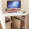 A white triangular corner computer desk with a computer, keyboard, mouse, and various desk accessories. Náhled obrázku produktu