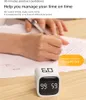 A person's hands are writing on a document, with a digital timer in the foreground. Produktbild-Vorschau