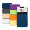 A stack of folded fitted sheets in various colors, with one sheet in its packaging in the foreground. Náhľad obrázku produktu