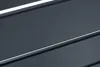 A close-up abstract view of a dark gray surface with thin white lines running diagonally across it. Produktbild-Vorschau