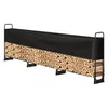 A long, black tarp covers the top half of a metal firewood rack filled with logs. Voir les images du produit