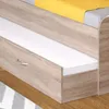 A close-up view of a bed frame with a drawer and a mattress. Podgląd zdjęcia produktu