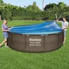 A couple is putting a solar cover on an above-ground pool in a backyard. Náhľad obrázku produktu