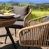 Outdoor patio furniture set on a wooden deck with a scenic view of rolling hills and mountains. Produktbild-Vorschau