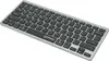 A silver and black ultra-slim keyboard is shown from a slightly elevated diagonal angle against a white background. Anteprima dell’immagine prodotto