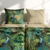 Two beds with bedding and pillows, one pillow has a peacock design, the other is plain beige. Produktbild-Vorschau