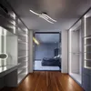 A modern walk-in closet with integrated lighting and a bedroom visible through a glass partition. Anteprima dell’immagine prodotto