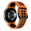 A close-up view of the back of a smartwatch with an orange and black sport band. Produktbild-Vorschau