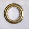 A close-up of a brass grommet on a white fabric. Produktbild-Vorschau