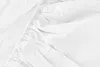 A close-up view of white fabric with elastic gathering. Anteprima dell’immagine prodotto