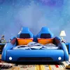 A child's bed designed to look like a race car, set against a starry night sky wallpaper. Anteprima dell’immagine prodotto