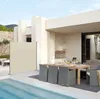 An outdoor patio area with a swimming pool, dining set, and a privacy screen. Produktbild-Vorschau
