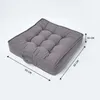A grey tufted floor cushion with dimensions indicated by measurement lines. Náhled obrázku produktu