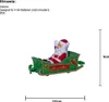 A Santa Claus figure in a sleigh with 'Merry Christmas' text on it, with size indicators. Podgląd zdjęcia produktu
