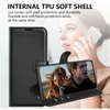 A woman is holding a phone in a black wallet case, with a close-up of the phone screen showing a couple. Produktbild-Vorschau