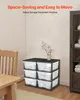 A stack of plastic drawers sits in a room next to a wooden chair and a dark wood cabinet. Podgląd zdjęcia produktu