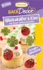 A product image showcasing cake decorations in the shape of ladybugs and four-leaf clovers, presented on cupcakes. Anteprima dell’immagine prodotto