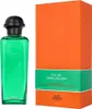 A bottle of Hermès Eau de Basilic Pourpre Eau de Cologne and its orange packaging are displayed against a white background. Náhled obrázku produktu