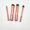 Four makeup brushes are laid out on a white background. Produktbild-Vorschau